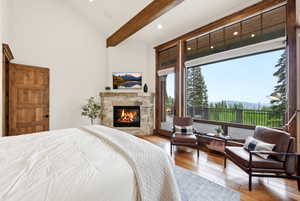 Expansive window wall with wood framing, offering exterior panorama