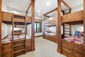 Carpeted bedroom featuring recessed lighting and baseboards