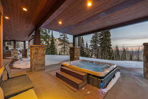 View of patio / terrace with a hot tub
