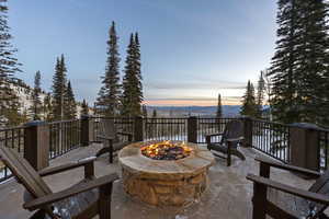 View of patio with a fire pit
