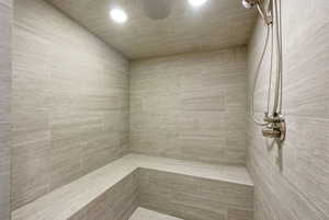 Bathroom with a sauna and tiled shower