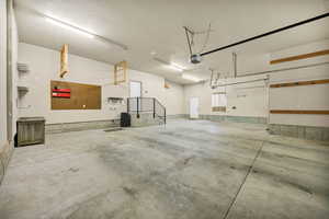 Garage featuring a garage door opener