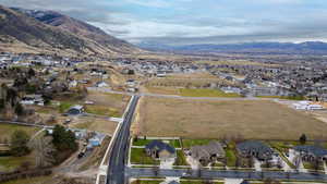 View of property location featuring nearby suburban area and a mountainous background