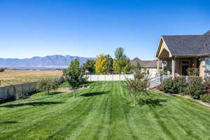 View of yard featuring covered porch and a mountain view