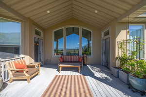 Wooden terrace featuring outdoor lounge area and a mountain view