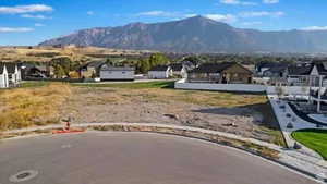 View of lot in neighborhood with mountain background