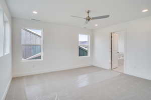 Unfurnished bedroom featuring light carpet, recessed lighting, and ceiling fan
