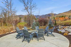 View of patio featuring a mountain view and a fire pit