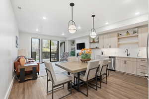 Dining area featuring light wood-type flooring and recessed lighting