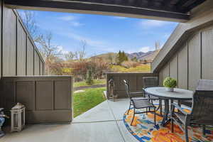 View of patio featuring a mountain view and outdoor dining space