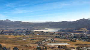 View of mountain backdrop featuring a large body of water