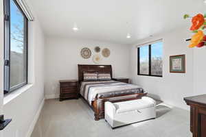 Bedroom featuring light colored carpet and recessed lighting