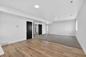 Unfurnished room featuring light wood-style floors and recessed lighting