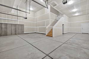 Garage featuring a garage door opener