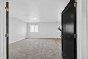 Unfurnished room with a textured ceiling