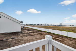 View of yard with a residential view and a balcony