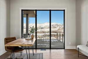 Dining room featuring a mountain view and wood finished floors