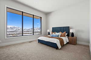 Bedroom featuring a mountain view and carpet flooring