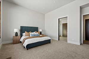 Carpeted bedroom featuring baseboards