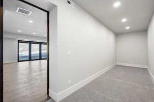 Empty room featuring recessed lighting and baseboards