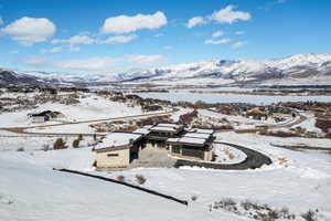 Snowy aerial view featuring a mountain view