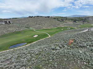 Surrounding community featuring a mountain view and golf course view