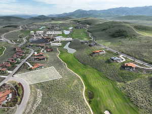 View of property location featuring a mountain backdrop and a golf course
