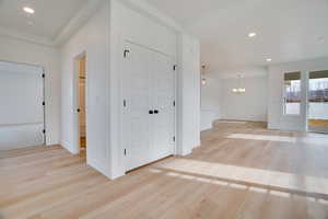 Foyer featuring recessed lighting, light wood-style flooring, and a chandelier