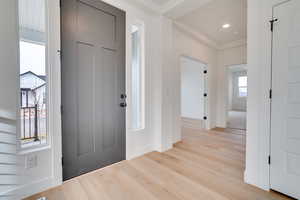 Entryway featuring wood finished floors and baseboards