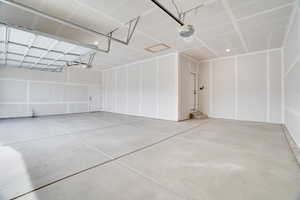 Garage featuring a garage door opener