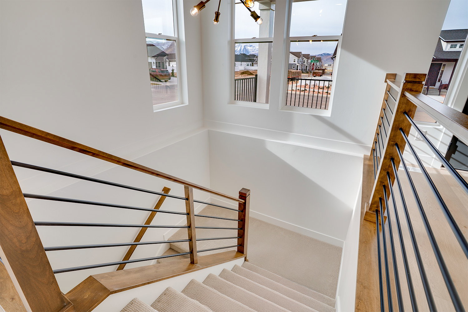 Stairway with baseboards and carpet flooring