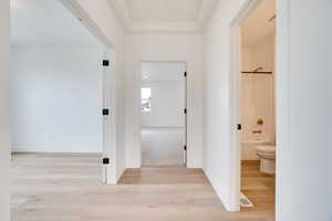 Hall with light wood-style flooring