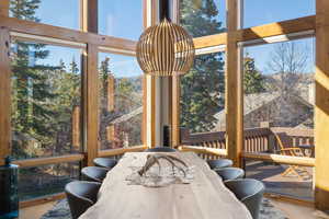 Sunroom with healthy amount of natural light and wood finished floors