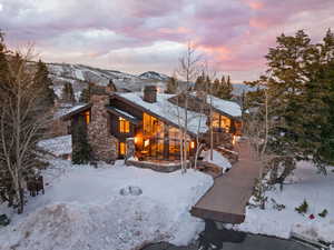 View of front of property featuring a chimney and a mountain view