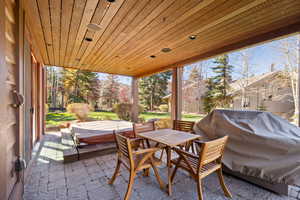 View of patio featuring a grill and outdoor dining area