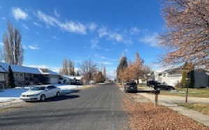 View of asphalt road with a residential view