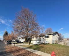 View of front of property featuring a front yard and a residential view