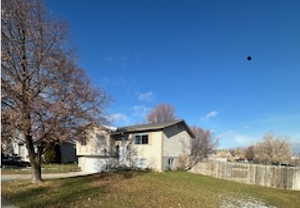View of property exterior featuring a yard
