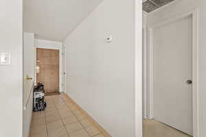 Corridor featuring baseboards