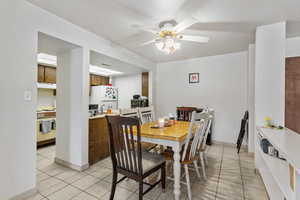 Dining room featuring ceiling fan and light tile patterned flooring