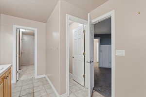 Bathroom featuring vanity and baseboards