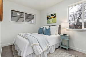 Carpeted bedroom with baseboards