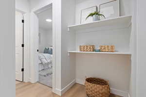 Corridor with light wood finished floors