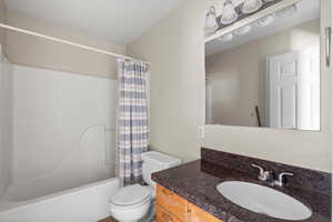 Bathroom with vanity and shower / bath combo