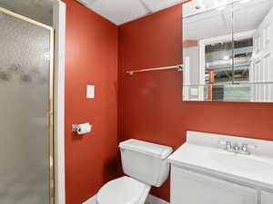 Full bath with a stall shower and vanity