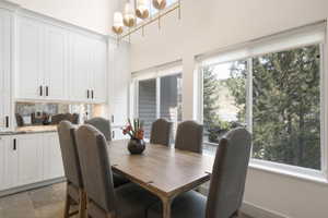 Dining room featuring light stone finish floors