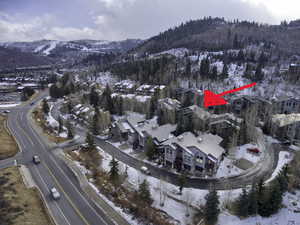 Snowy aerial view featuring a mountain view