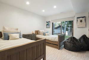 Bedroom featuring access to outside, recessed lighting, and light wood finished floors