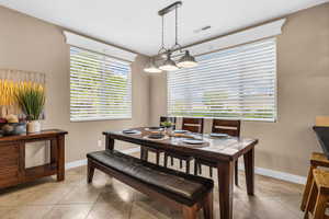 Dining room featuring light tile patterned floors