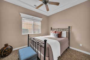 Bedroom featuring carpet flooring and ceiling fan